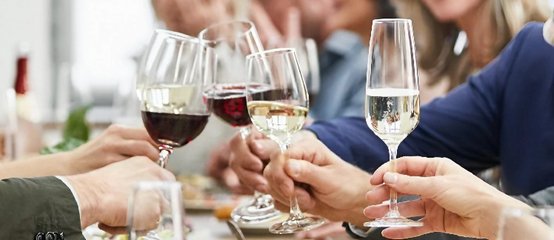 Friends clink glasses and celebrate
