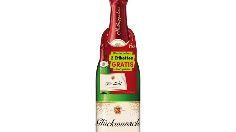 Rotkäppchen Flasche 0,75 l mit selbst gestaltetem Etikett "Glückwünsch" sowie einem roten Flaschenanhänger