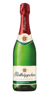 Eine Flasche Rotkäppchen Sekt mit grünem Glas und rotem Korken, beschriftet mit 'Trocken' und dem Wappen auf dem Etikett.