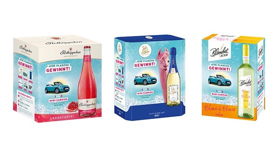 Die Boxen enthalten verschiedene Getränke, darunter Granatapfel, einen trockenen Sekt und einen Weißwein.