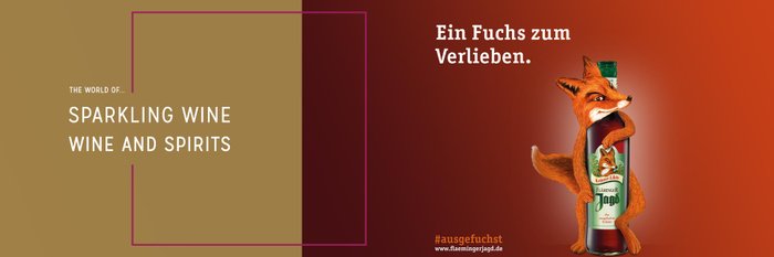 A stylized fox proudly presents a bottle of herbal liqueur against a warm background.