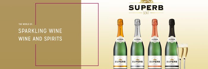 Various bottles of sparkling wine with the SUPERB label, surrounded by glasses.