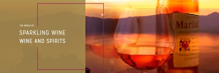 A glass of shimmering wine that reflects the warm tones of the sunset.