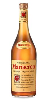 A stylish bottle of Mariacron brandy, shining in soft light and emphasizing the fine quality of its contents.