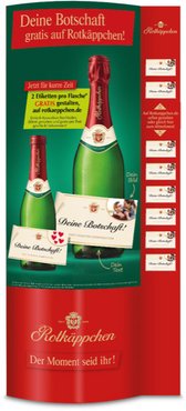Die Werbung zeigt zwei Flaschen Rotkäppchen Sekt mit einem Aufruf zur Gestaltung von kostenlosen Etiketten für besondere Anlässe.