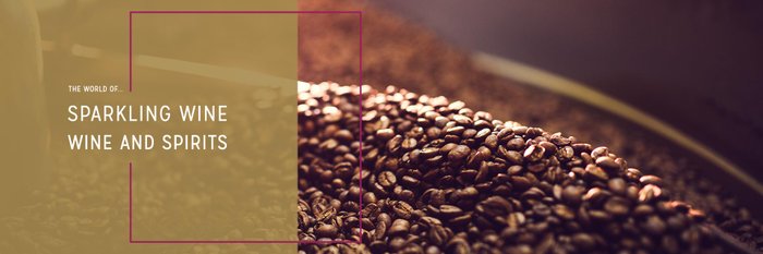 A picture of roasted coffee beans, gleaming in the light.